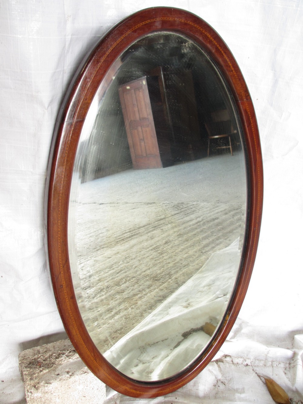 Edwardian inlaid mahogany oval wall hanging mirror with bevel glass