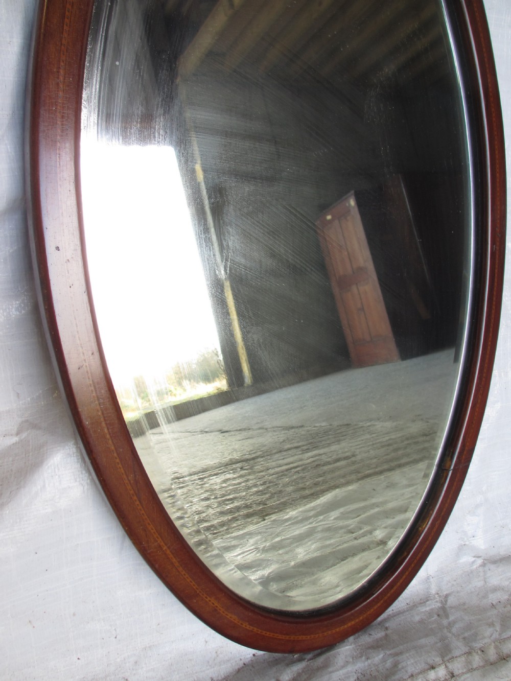 Edwardian inlaid mahogany oval wall hanging mirror with bevel glass View IV