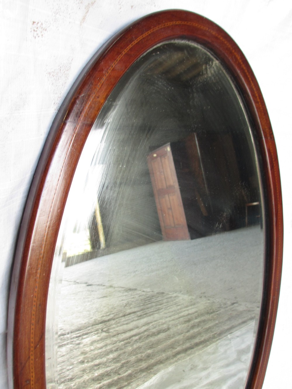 Edwardian inlaid mahogany oval wall hanging mirror with bevel glass View V