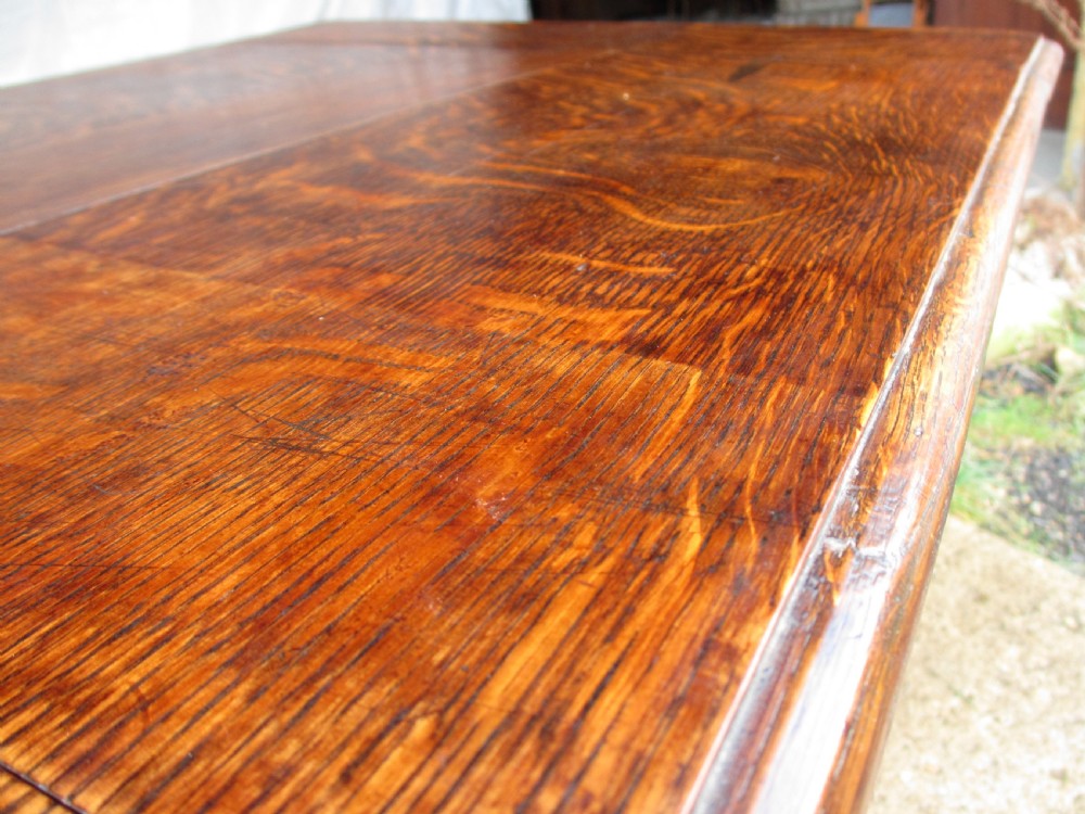 A Victorian dark oak drop-leaf breakfast table featuring a rectangular surface with grain figure, a turned central pedestal stem, and splayed legs. View IX
