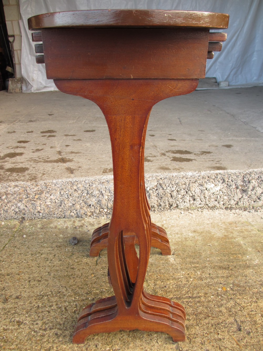 A set of four nested mahogany side tables featuring kidney-shaped tops with floral marquetry inlay. View X