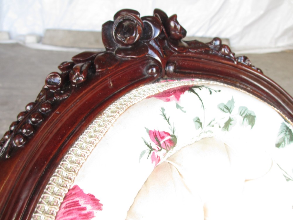 Early Victorian mahogany carved show wood button upholstered spoon back armchair View III