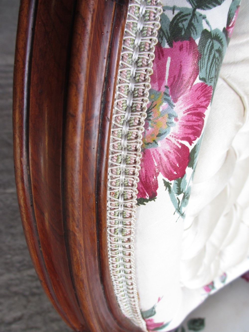 Early Victorian mahogany carved show wood button upholstered spoon back armchair View IV