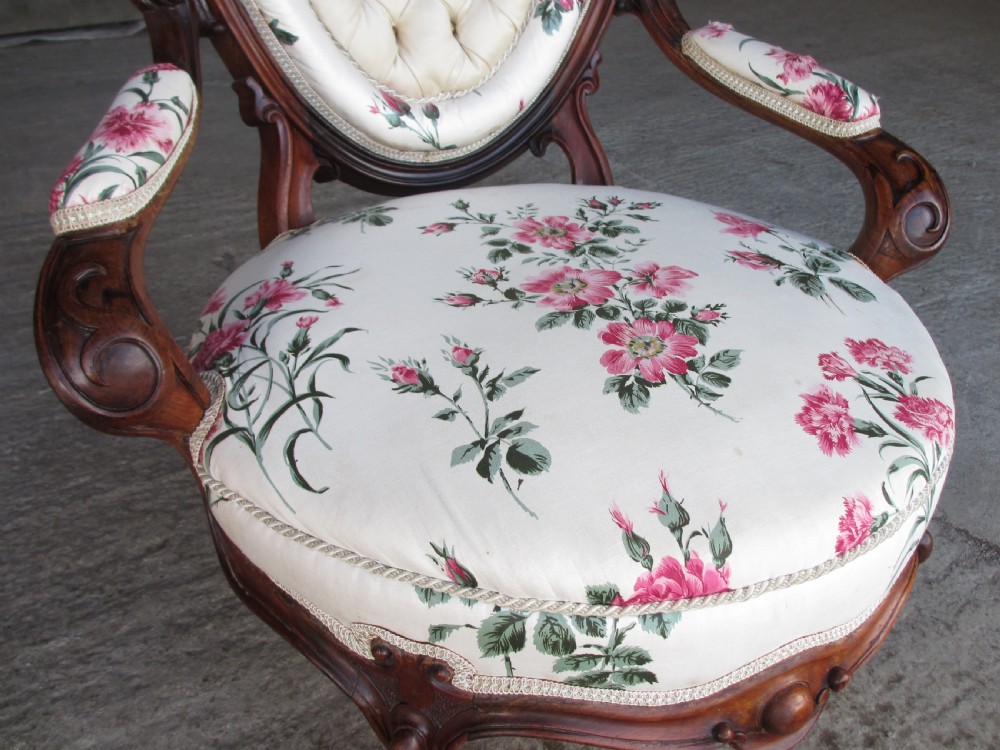 Early Victorian mahogany carved show wood button upholstered spoon back armchair View VI