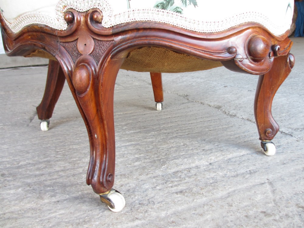 Early Victorian mahogany carved show wood button upholstered spoon back armchair View IX