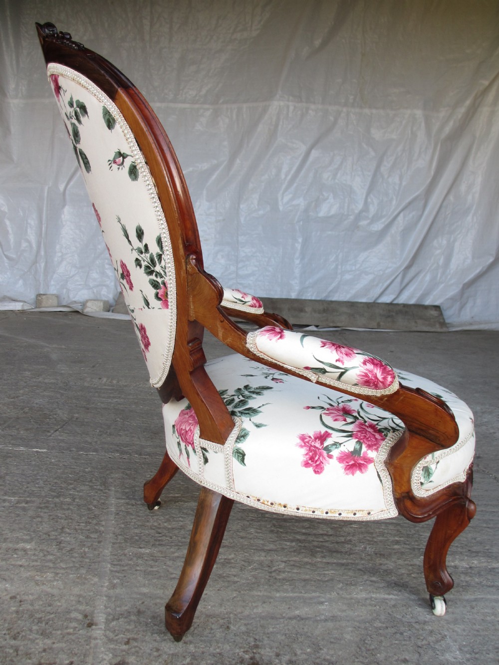 Early Victorian mahogany carved show wood button upholstered spoon back armchair View X