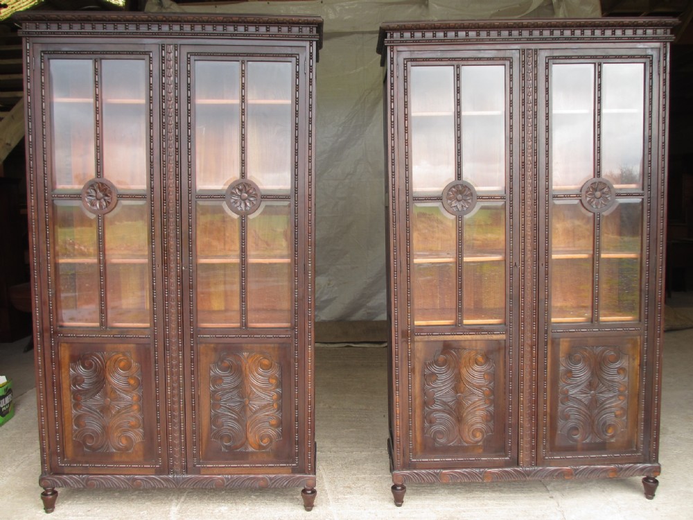 Pair of carved Brazilian mahogany glazed bookcases 
