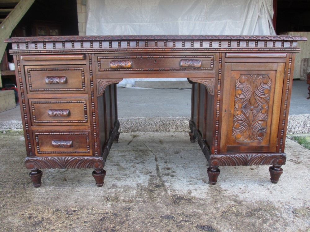 Carved Brazilian mahogany pedestal desk 