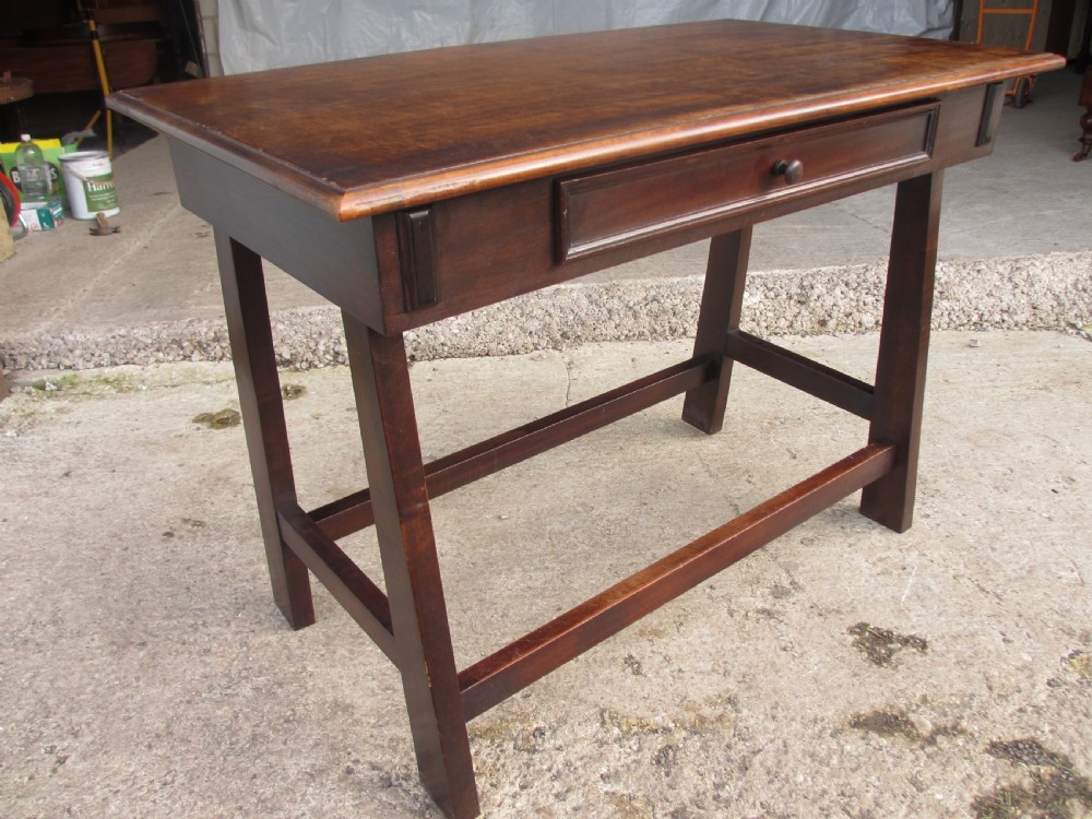 A dark mahogany wooden side table featuring a single frieze drawer with a wooden knob handle and lower cross stretchers. View II