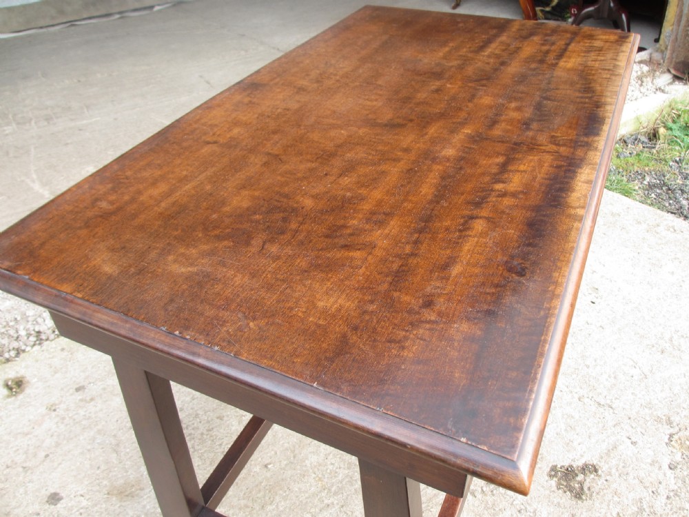 A dark mahogany wooden side table featuring a single frieze drawer with a wooden knob handle and lower cross stretchers. View IV