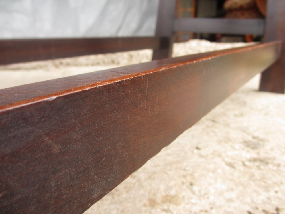 A dark mahogany wooden side table featuring a single frieze drawer with a wooden knob handle and lower cross stretchers. View VIII