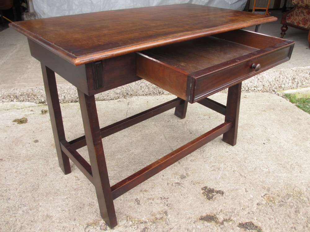 A dark mahogany wooden side table featuring a single frieze drawer with a wooden knob handle and lower cross stretchers. View IX