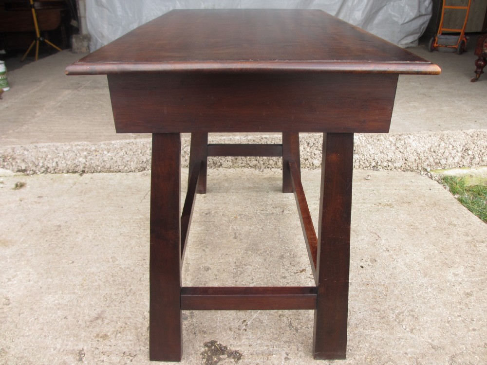 A dark mahogany wooden side table featuring a single frieze drawer with a wooden knob handle and lower cross stretchers. View XI