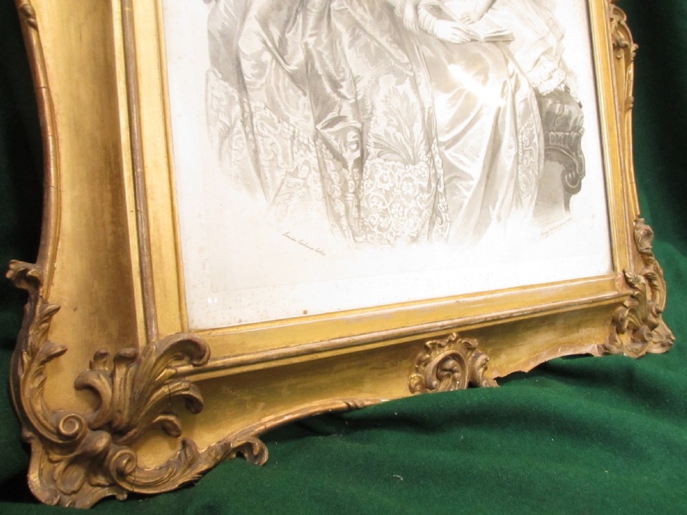A rectangular gold gilt frame with ornate scroll detailing containing a monochrome portrait drawing of a mother and daughter. View IV