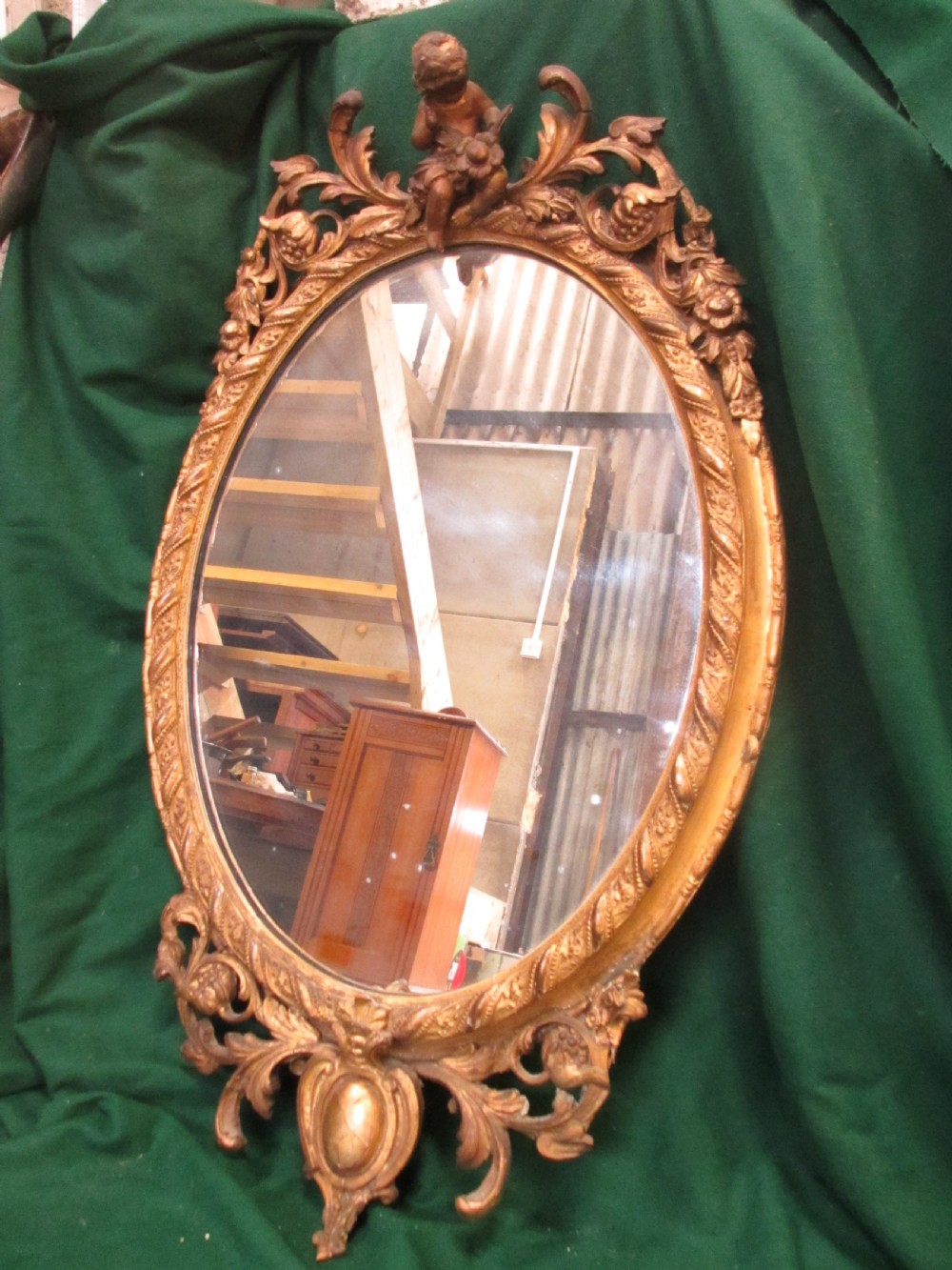 18th century gilt framed oval wall hanging mirror