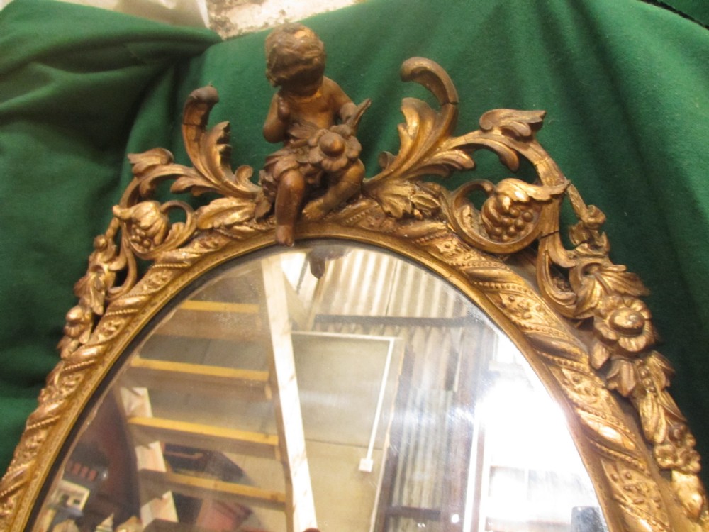 18th century gilt framed oval wall hanging mirror View IV