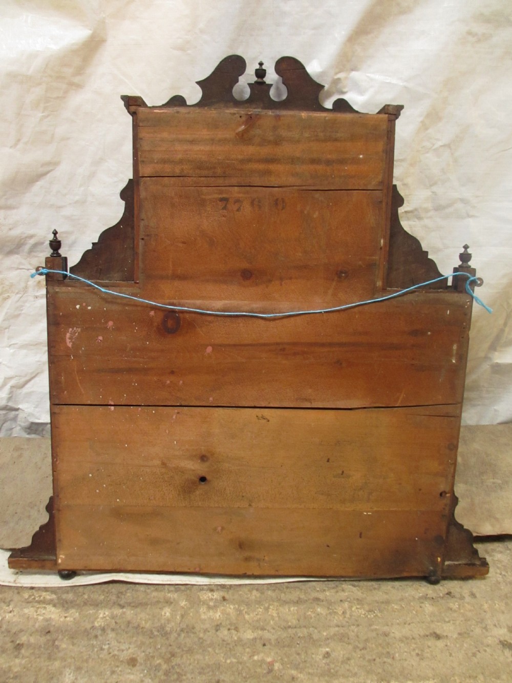 A carved mahogany Victorian overmantel mirror featuring multiple glass panels, side display shelves, turned spindle pillars, and stylised foliage carving. View XI