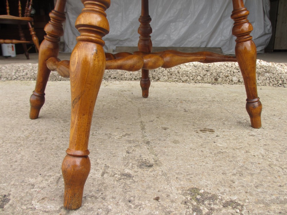 Pair of 19th century elm seated captain smokers bow arm chairs View V