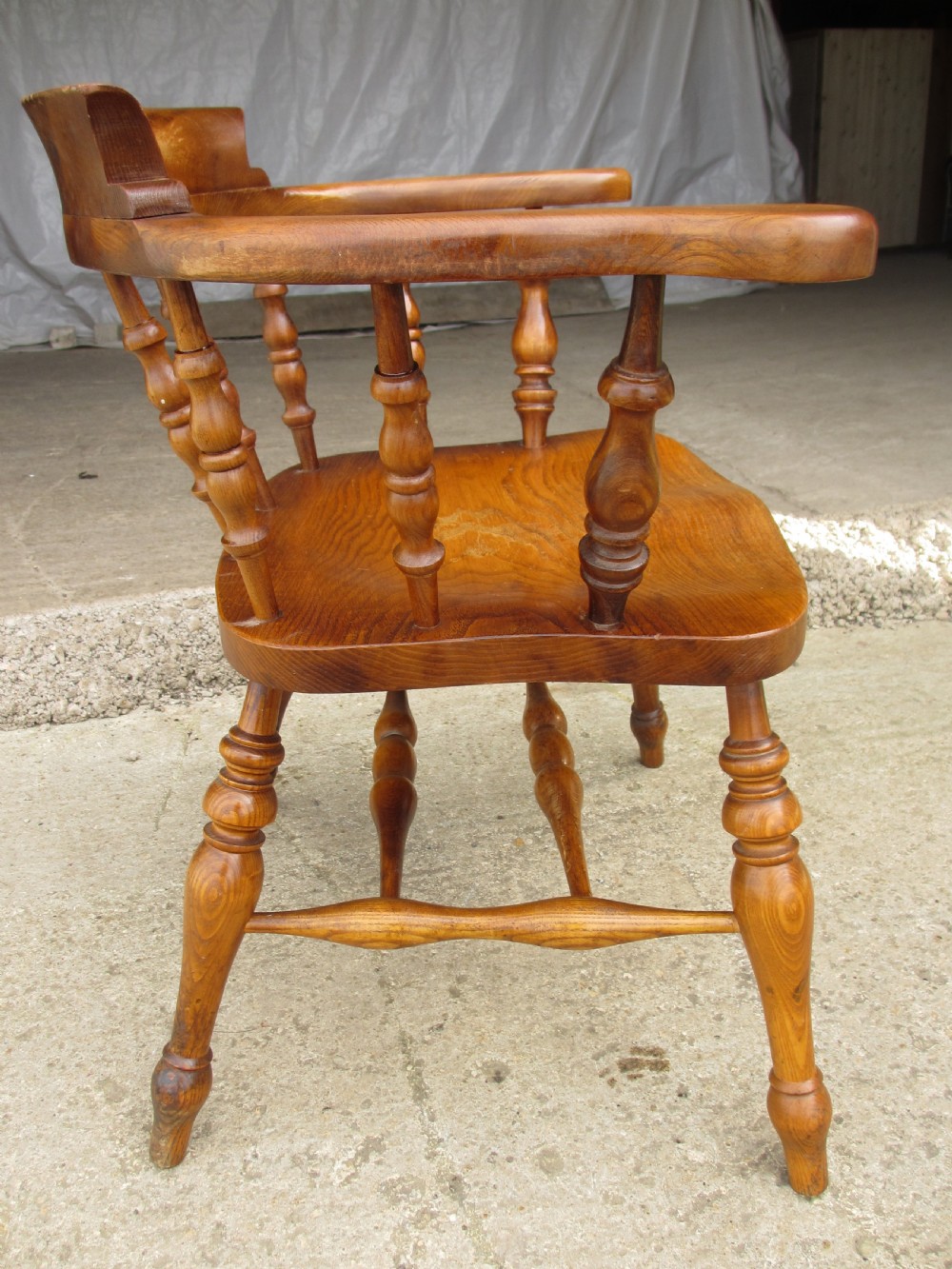 Pair of 19th century elm seated captain smokers bow arm chairs View VII