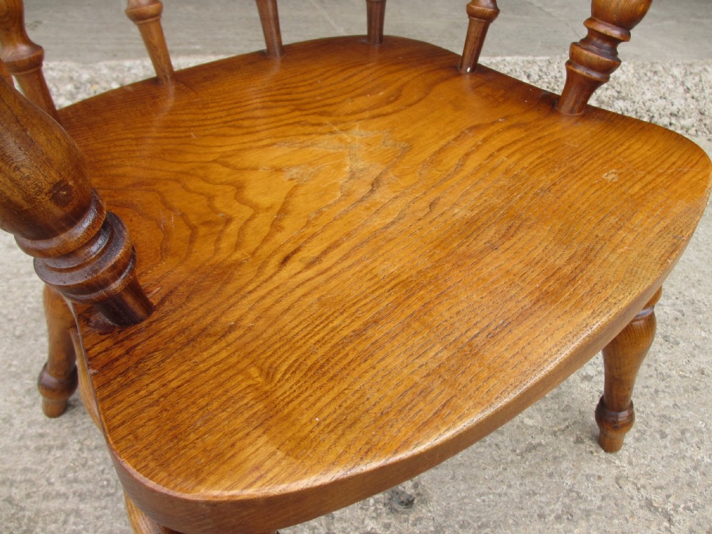Pair of 19th century elm seated captain smokers bow arm chairs View VIII