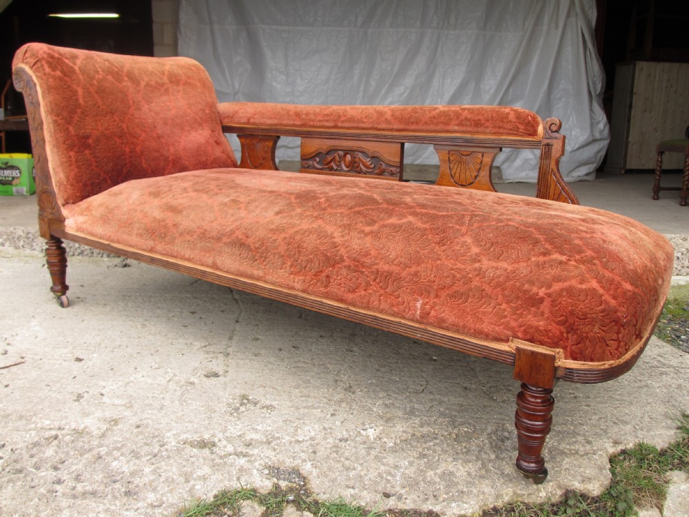 Victorian carved mahogany upholstered chaise longue View II