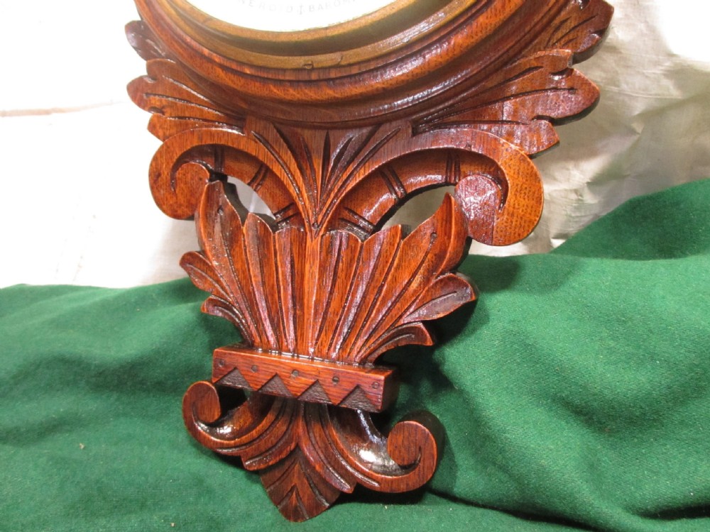 Lovely Victorian carved Oak wheel barometer by Brannon London  View V