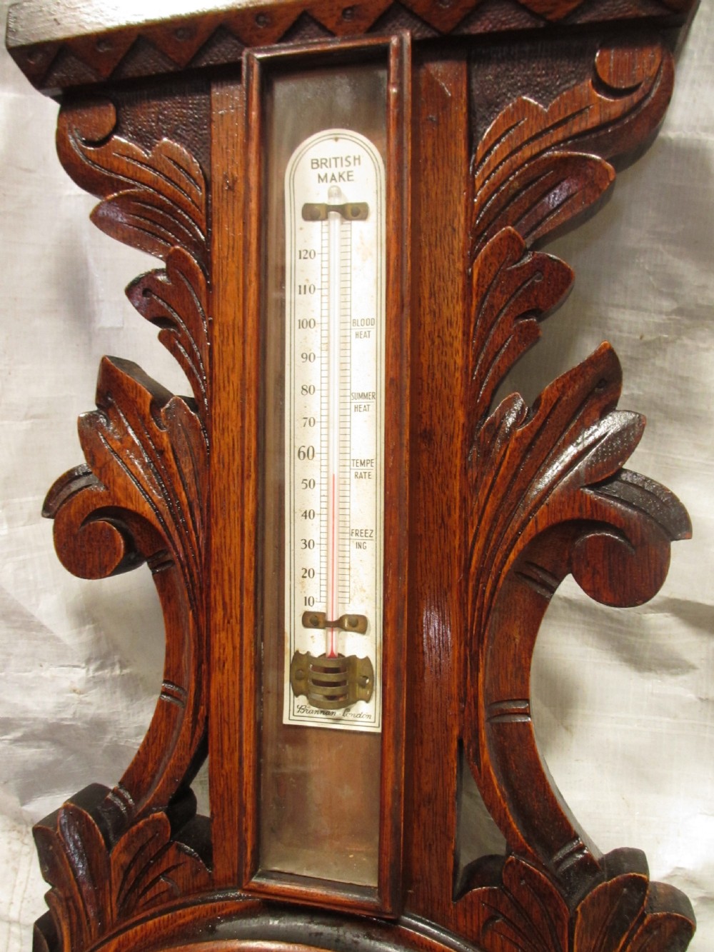 Lovely Victorian carved Oak wheel barometer by Brannon London  View VII