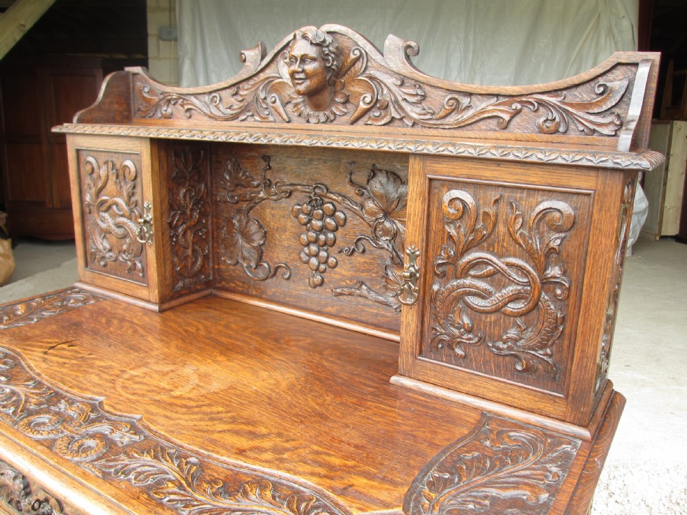Unusual Victorian serpentine carved Oak writing desk View III