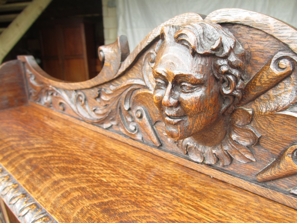 Unusual Victorian serpentine carved Oak writing desk View IV