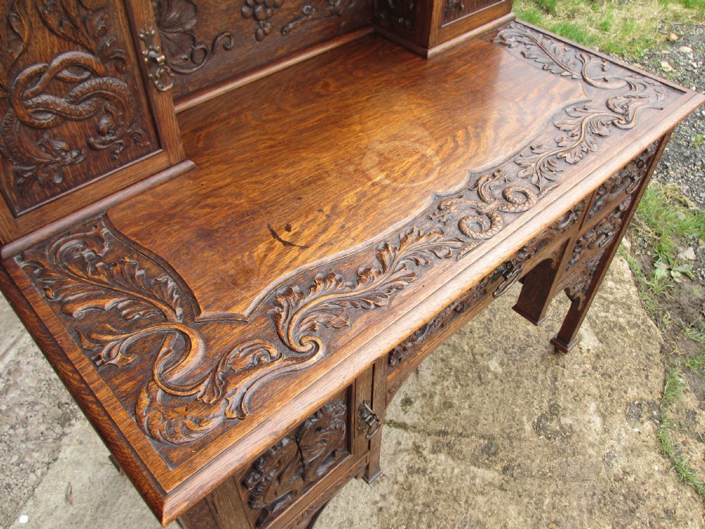 Unusual Victorian serpentine carved Oak writing desk View VII