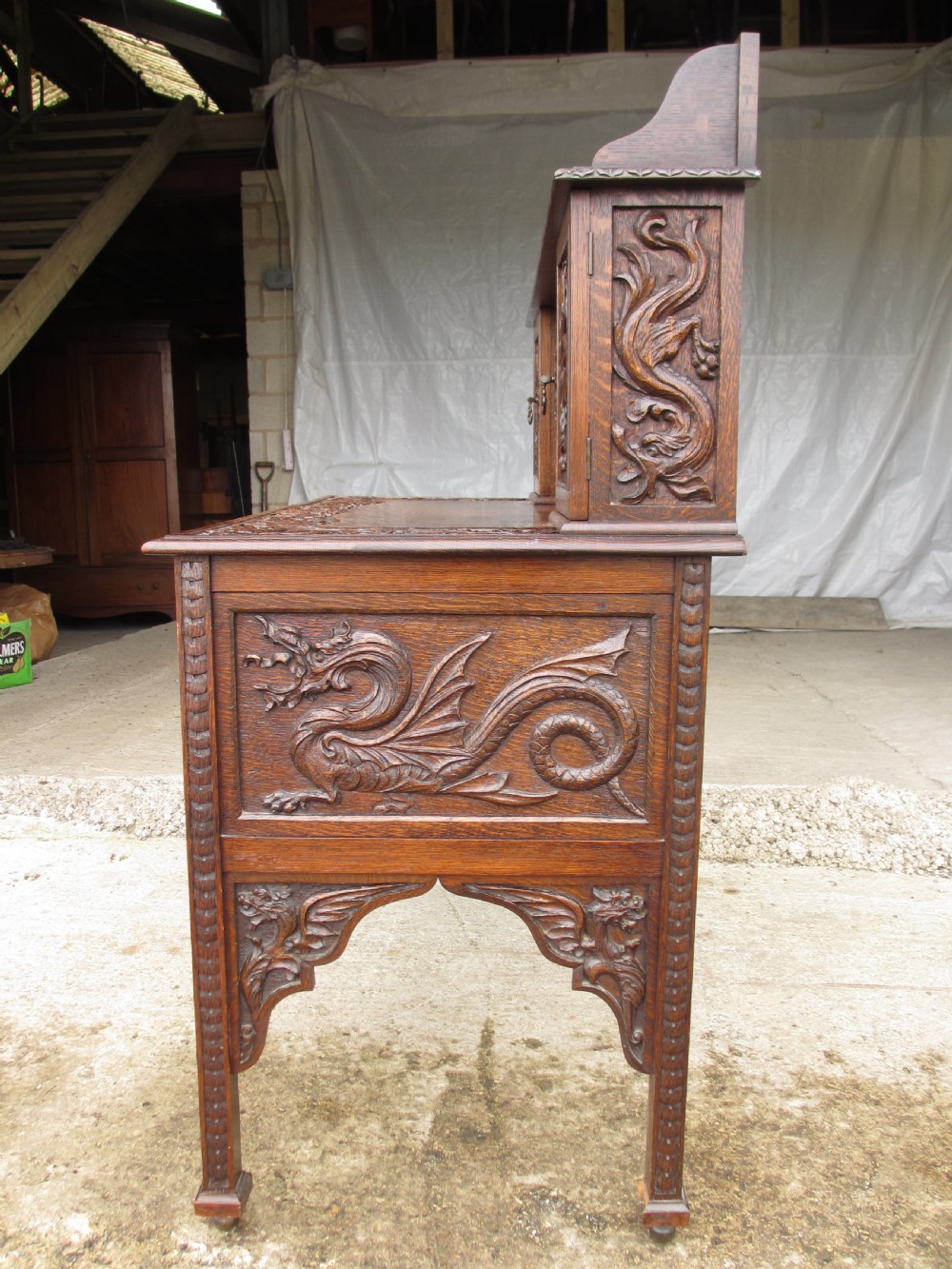 Unusual Victorian serpentine carved Oak writing desk View XI