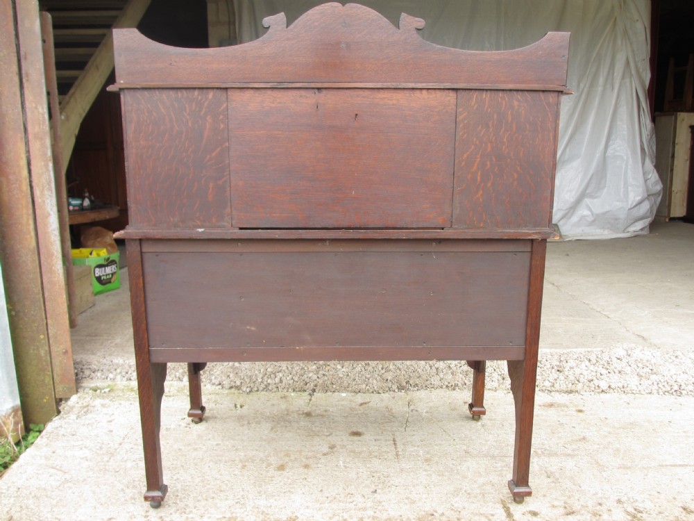 Unusual Victorian serpentine carved Oak writing desk View XII