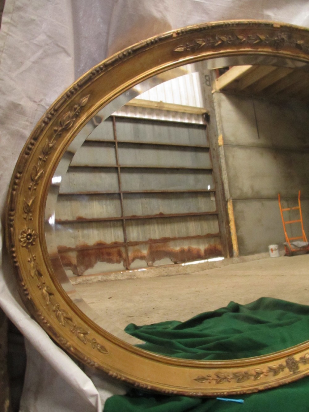 Early 19th century oval gilt framed bevel edged mirror View II