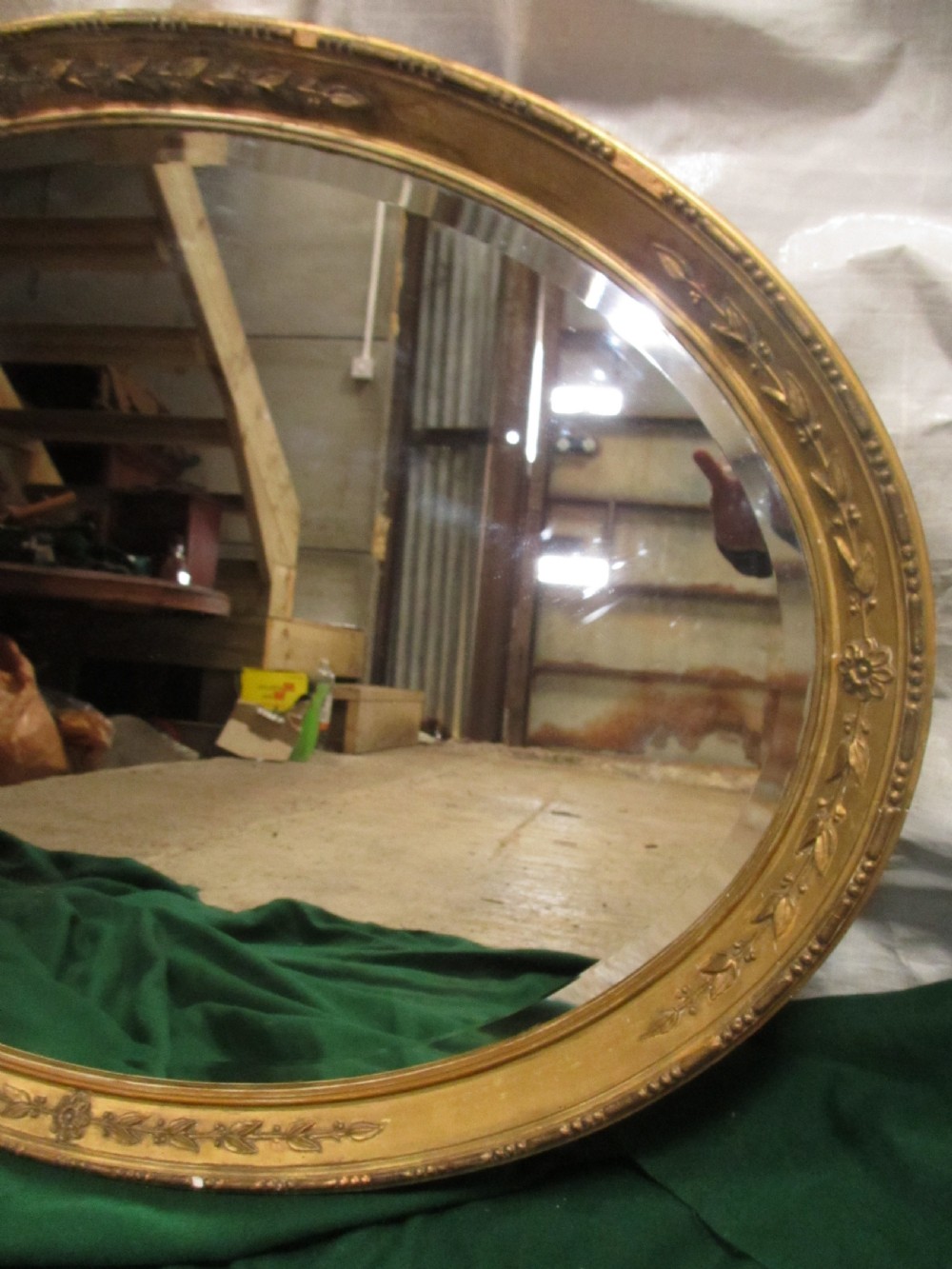 Early 19th century oval gilt framed bevel edged mirror View III