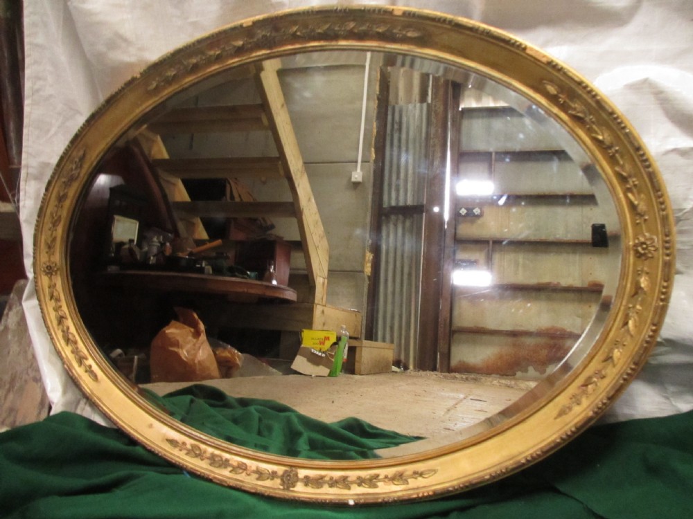 Early 19th century oval gilt framed bevel edged mirror View IV