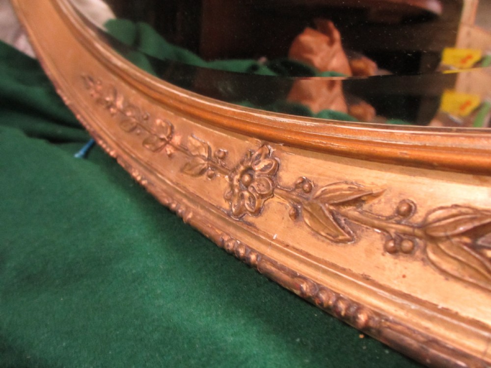 Early 19th century oval gilt framed bevel edged mirror View V