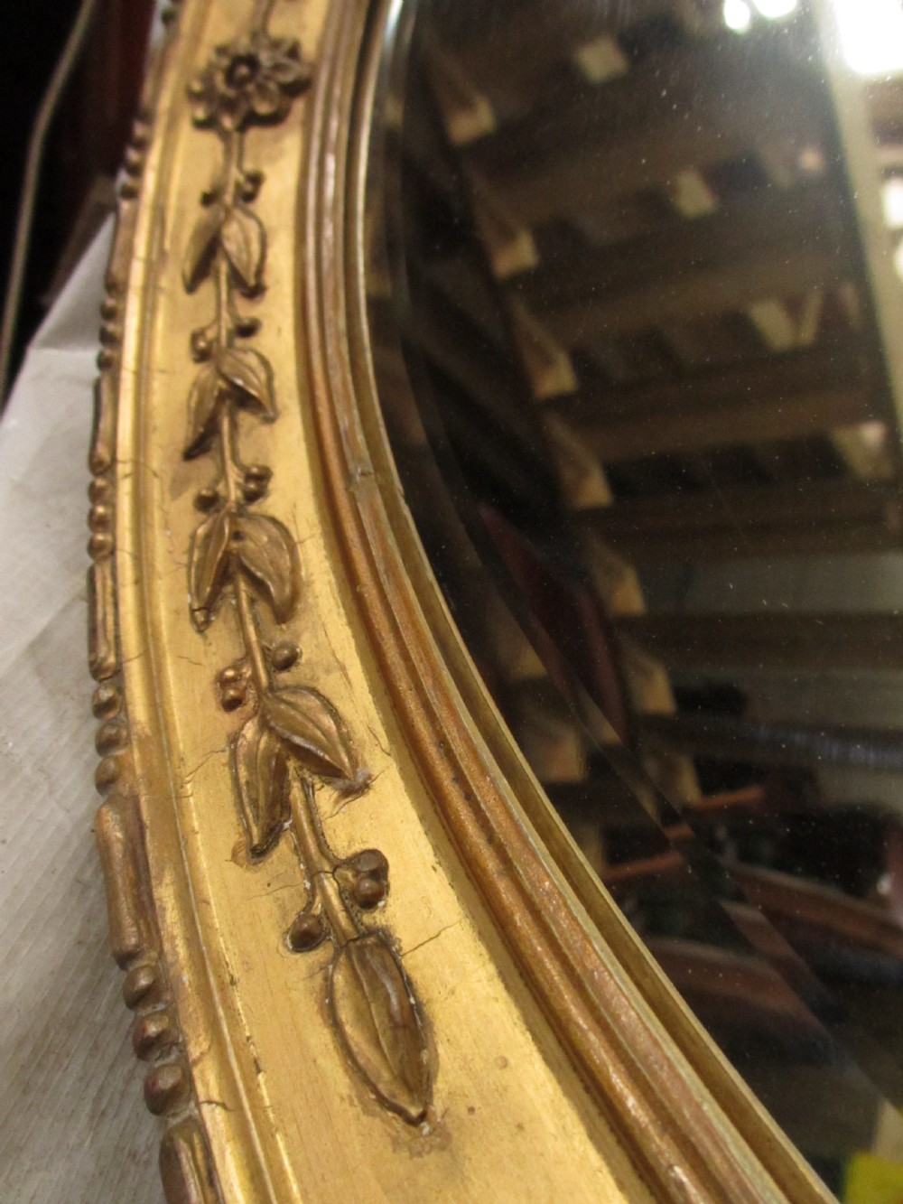 Early 19th century oval gilt framed bevel edged mirror View VII