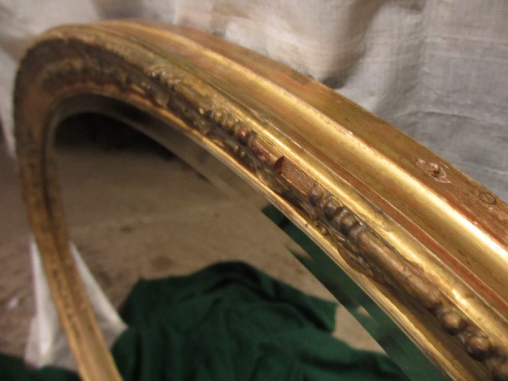 Early 19th century oval gilt framed bevel edged mirror View VIII