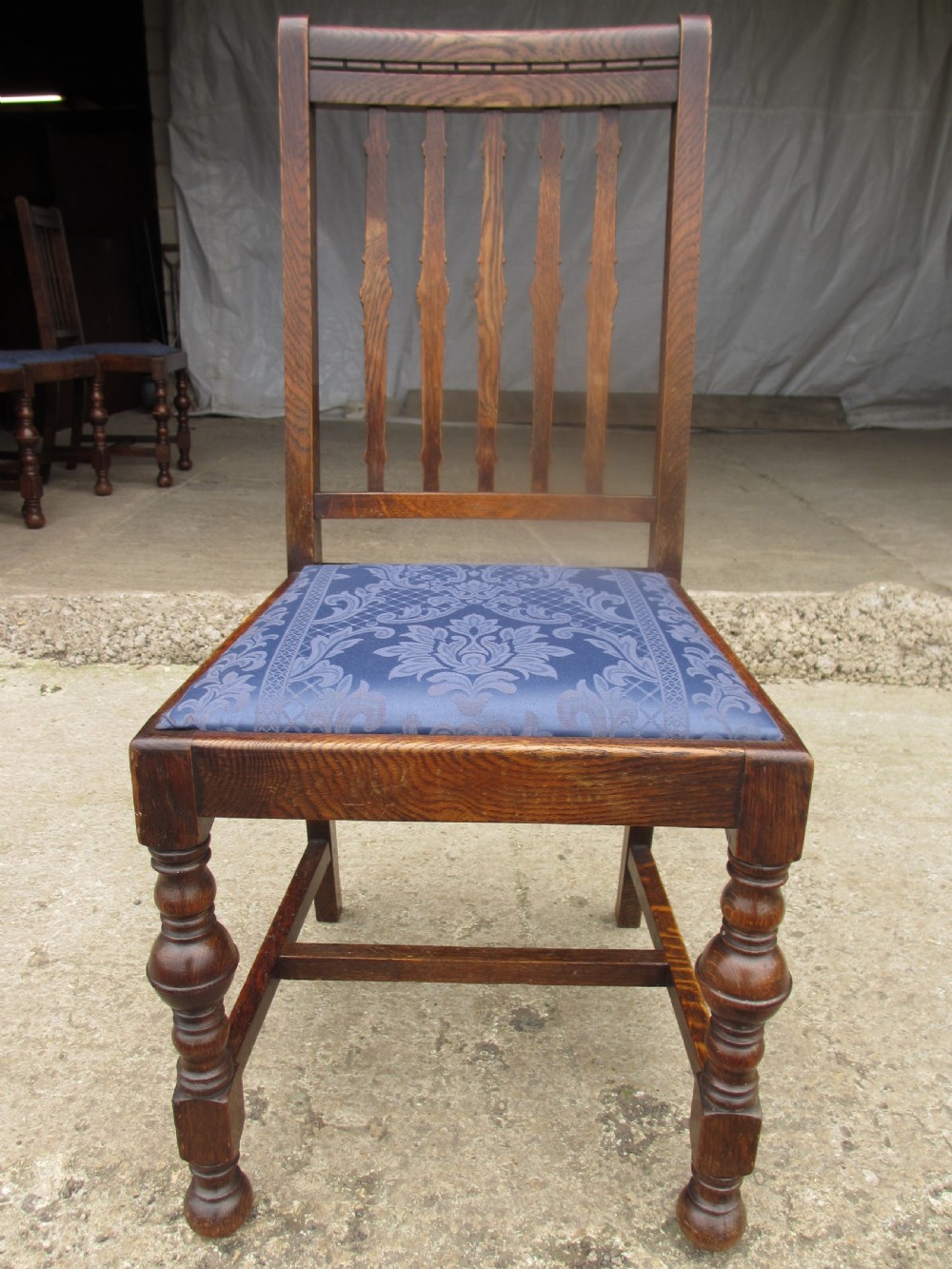 Four late 19th century oak slat back dining chairs  View V