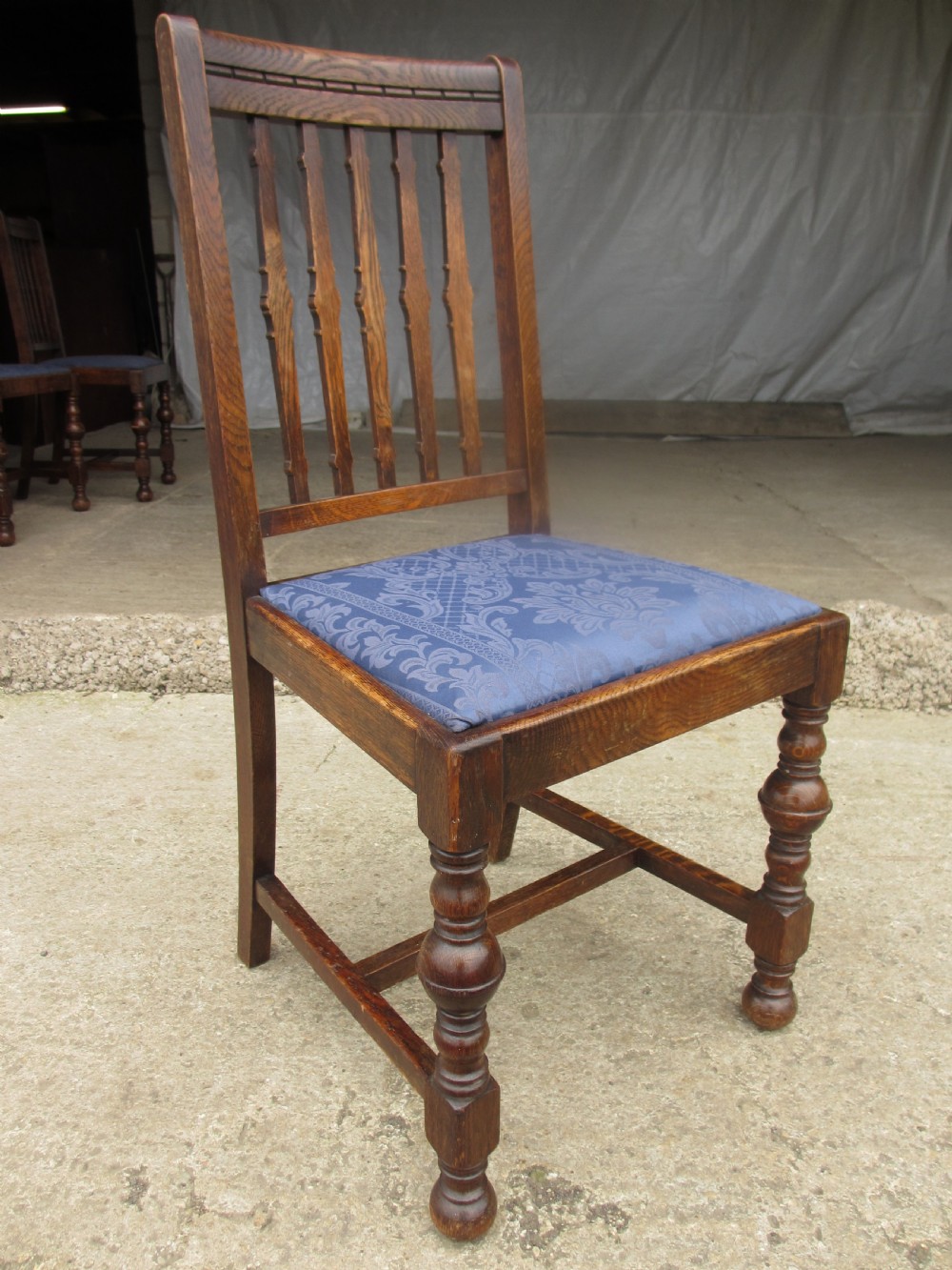 Four late 19th century oak slat back dining chairs  View VI