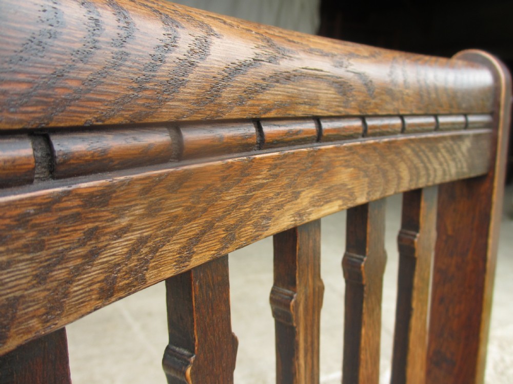 Four late 19th century oak slat back dining chairs  View VIII