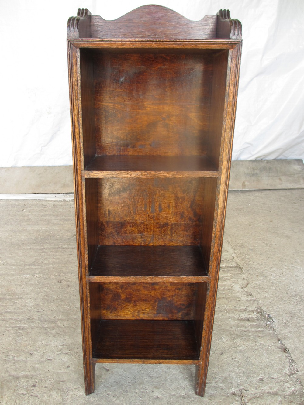 Edwardian slender oak bookcase with fifteen volumes of Dickens