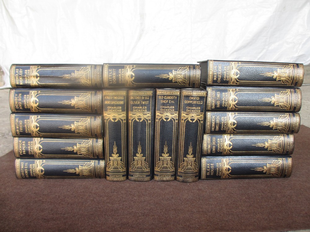 Edwardian slender oak bookcase with fifteen volumes of Dickens View V