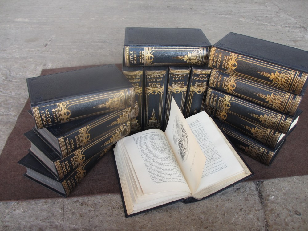 Edwardian slender oak bookcase with fifteen volumes of Dickens View VI