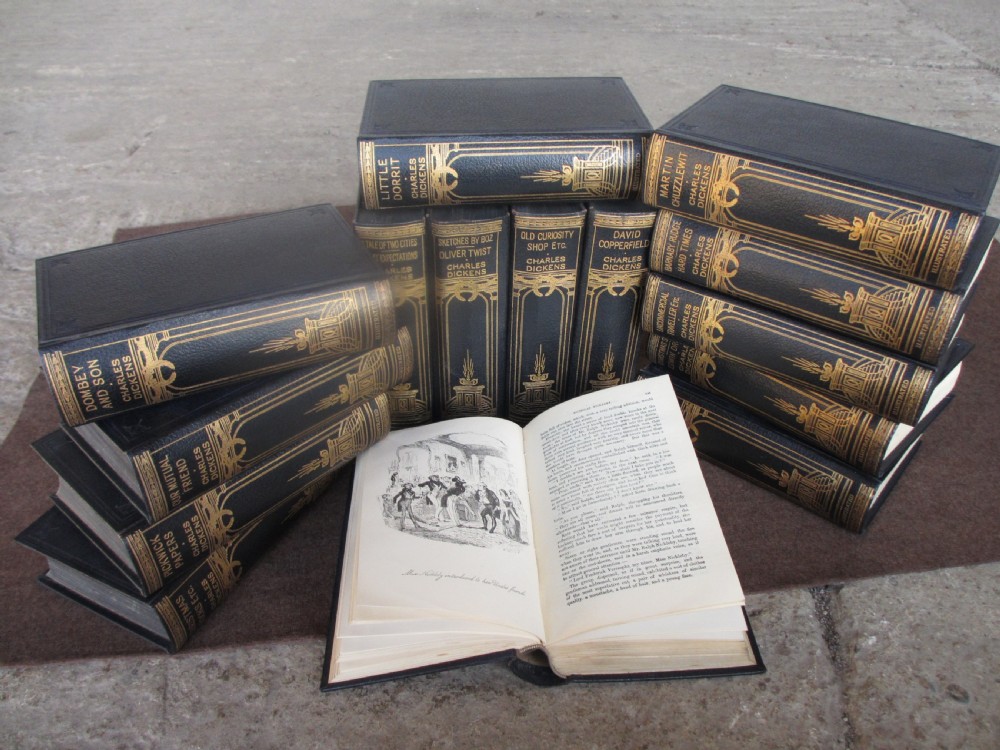 Edwardian slender oak bookcase with fifteen volumes of Dickens View VII