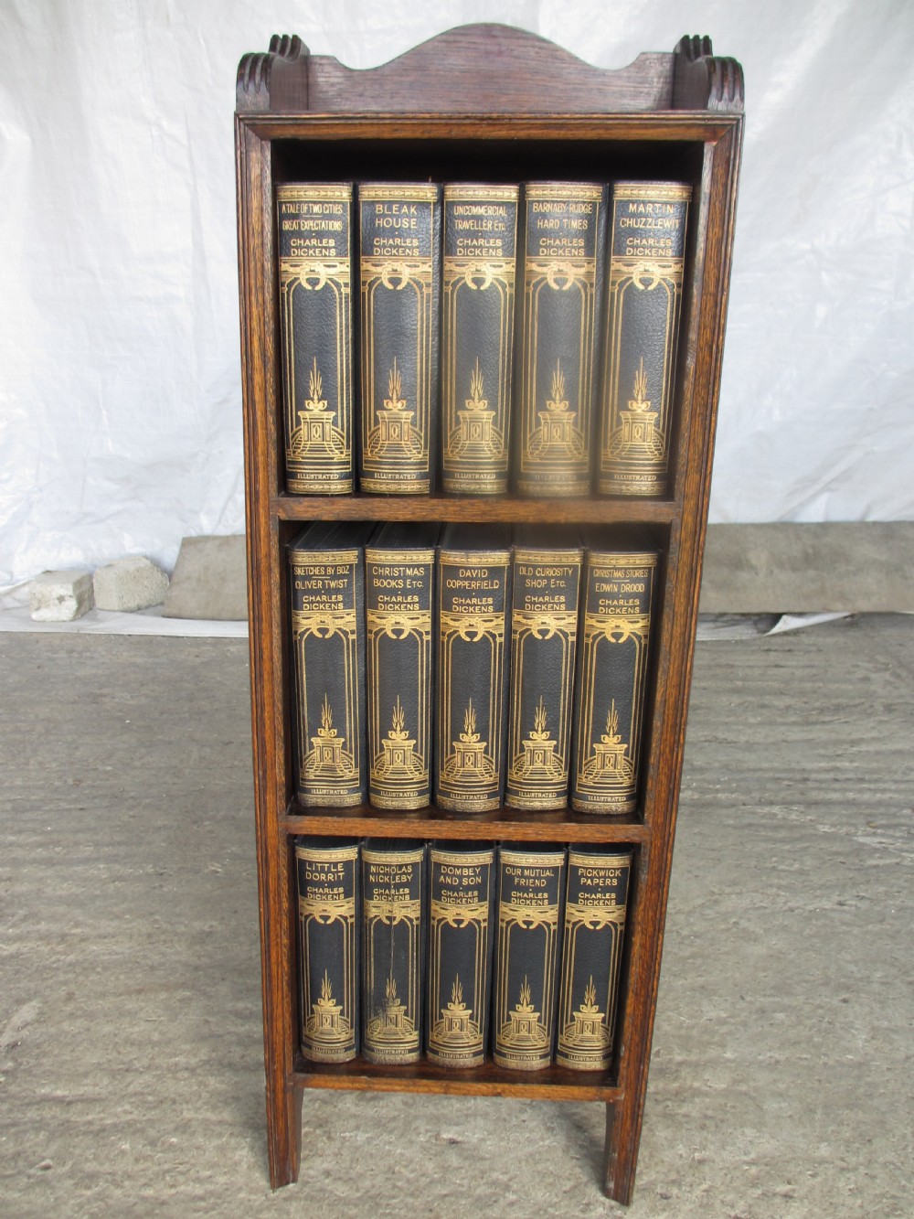 Edwardian slender oak bookcase with fifteen volumes of Dickens View IX