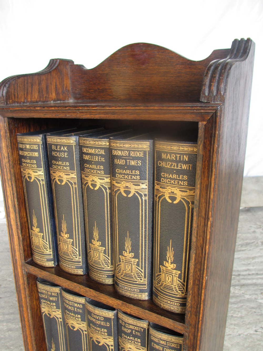 Edwardian slender oak bookcase with fifteen volumes of Dickens View XI