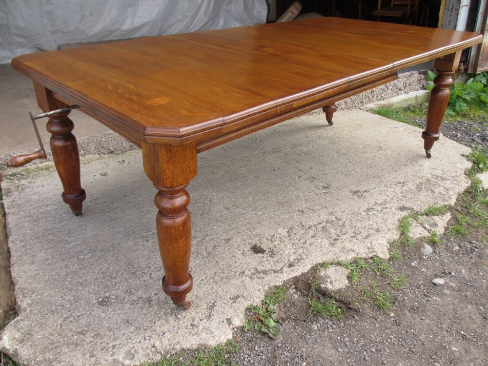 Victorian golden oak wind out extending dining table View II