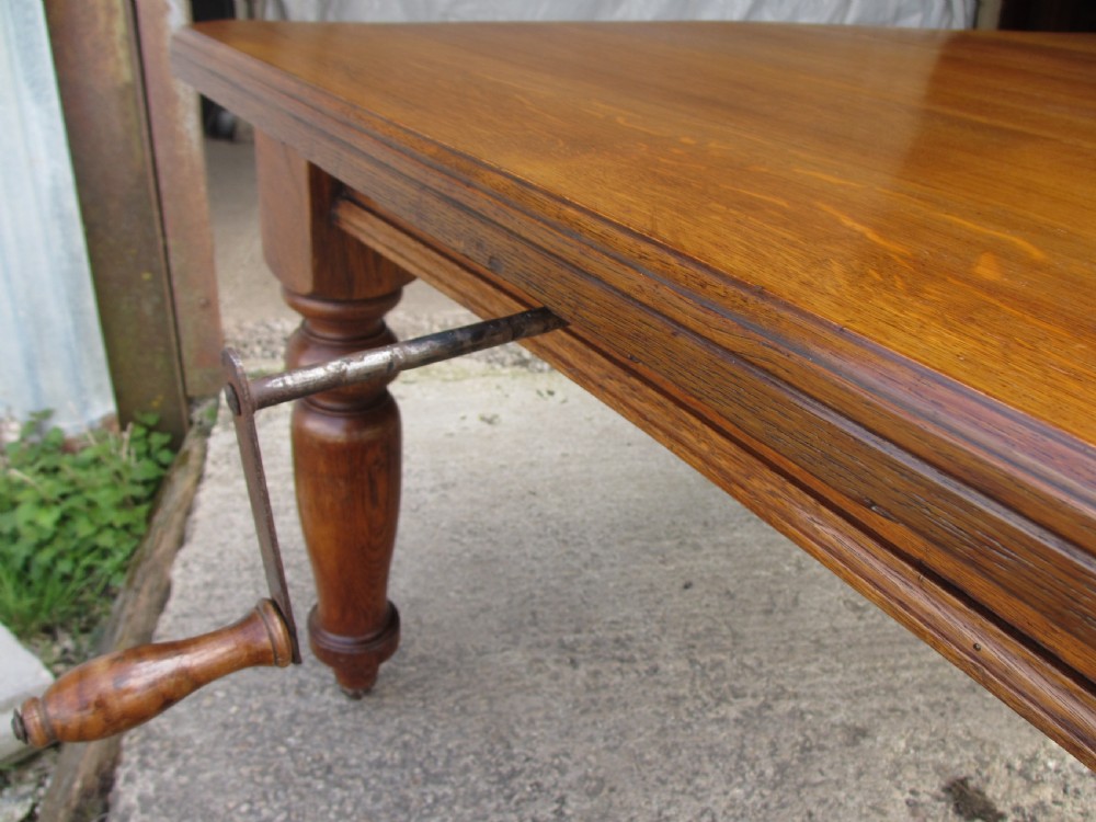 Victorian golden oak wind out extending dining table View IV