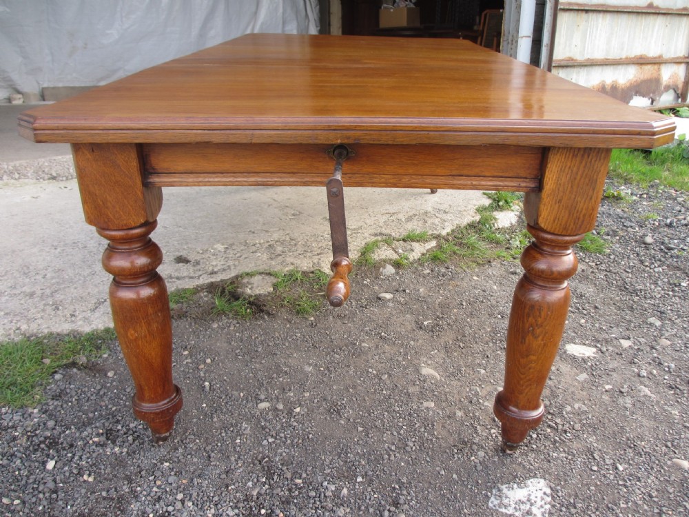 Victorian golden oak wind out extending dining table View V